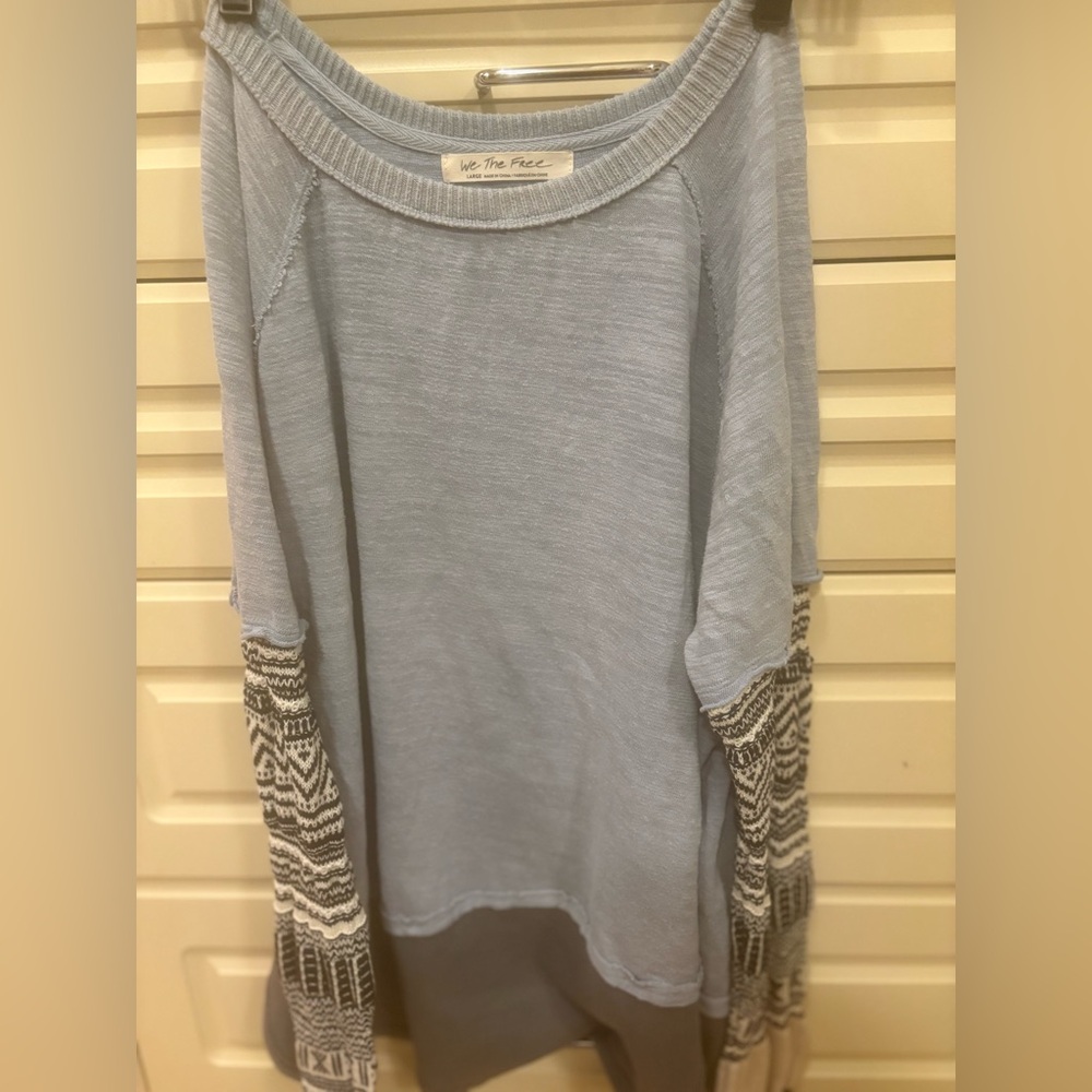 Free people, long sleeve waffle shirt with pattern sleeves.